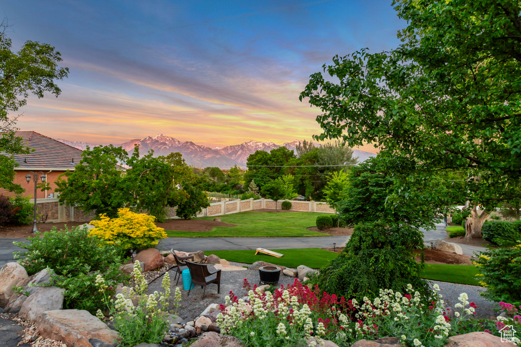 View of yard with a mountain view and a fire pit