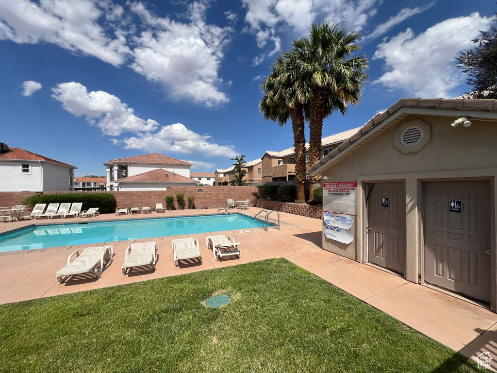 Community pool with a patio