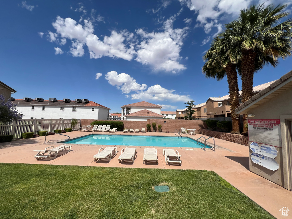 Community pool with a patio