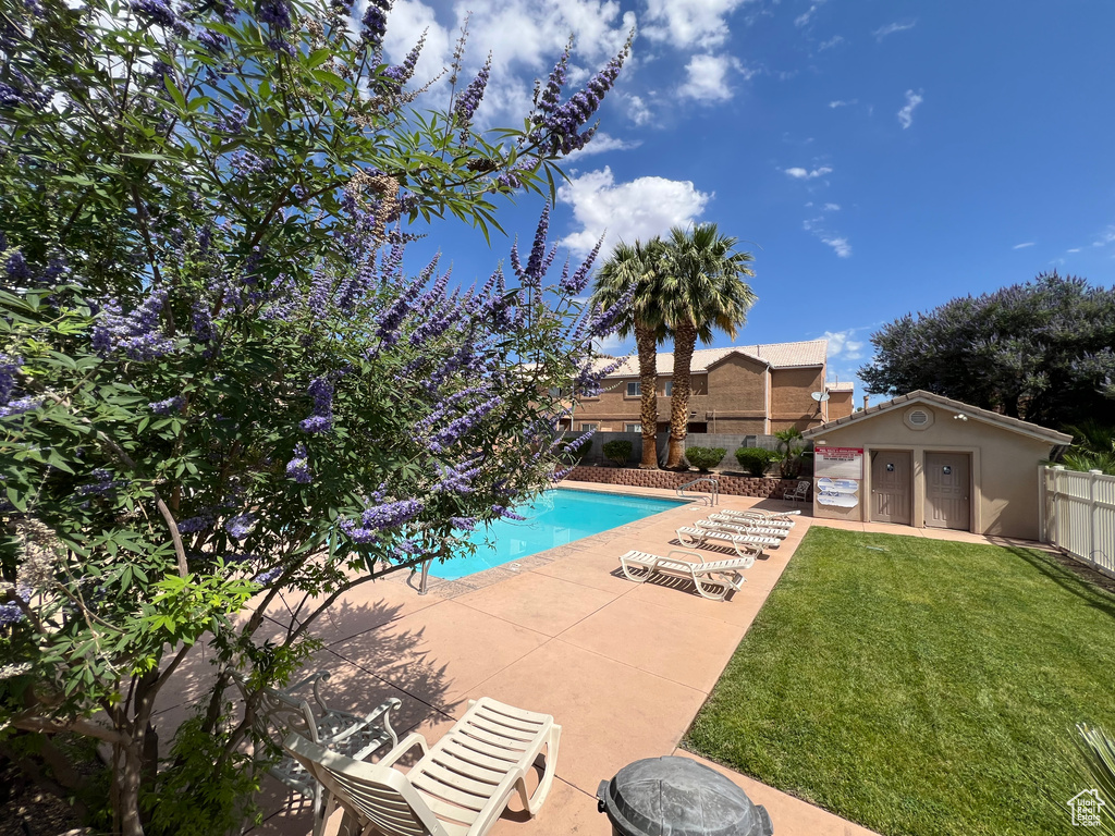 Community pool with a patio