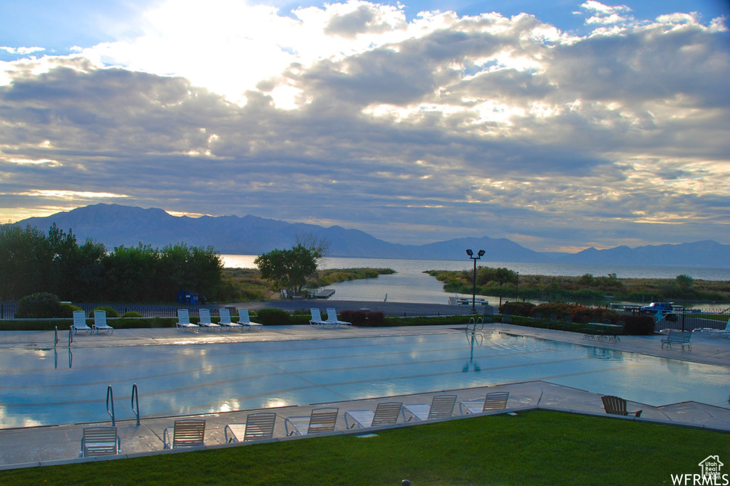Community pool featuring a water and mountain view