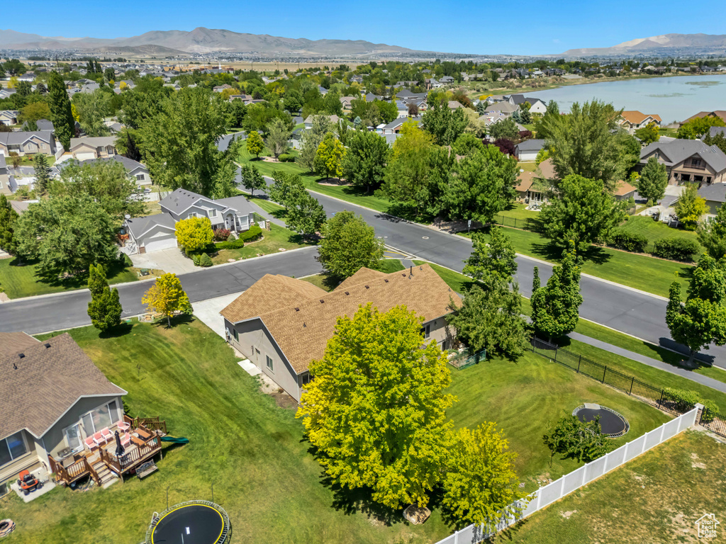 Aerial perspective of suburban area featuring a water and mountain view