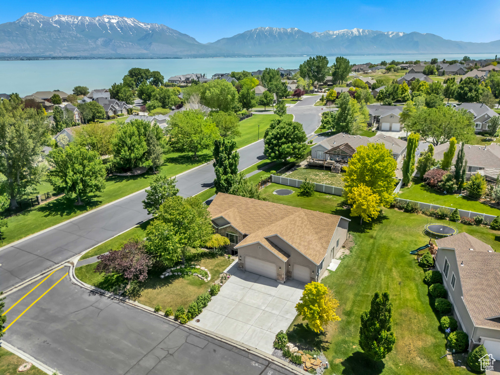 Aerial view of residential area featuring a water and mountain view