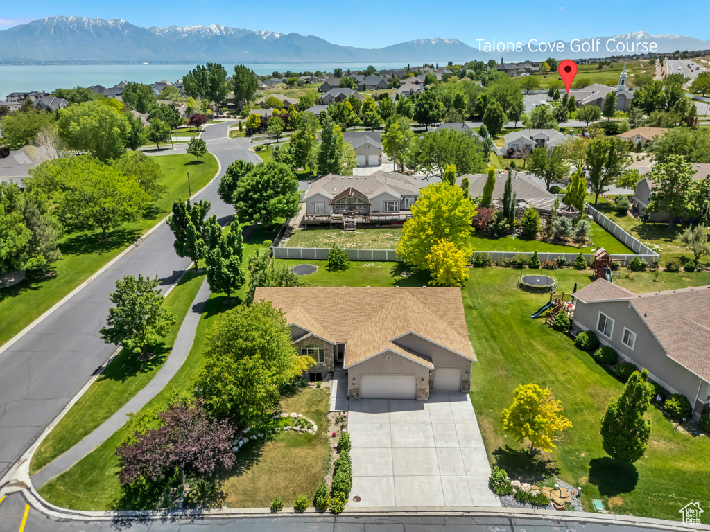 Aerial perspective of suburban area with a mountain backdrop
