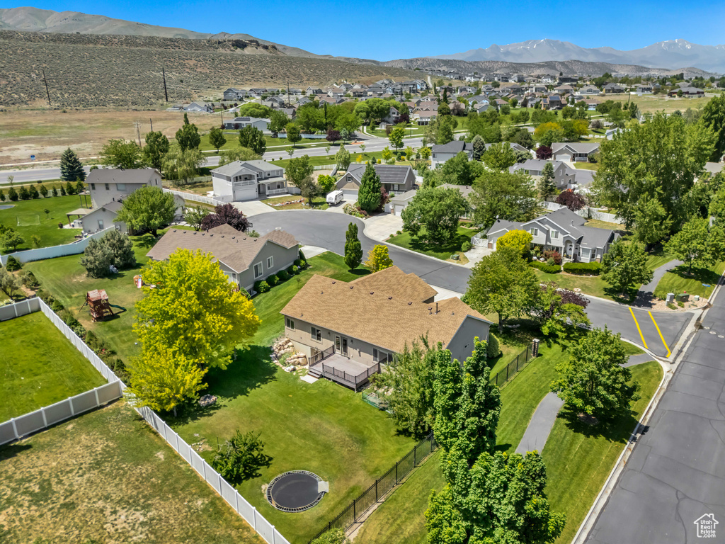 Aerial perspective of suburban area featuring a mountainous background