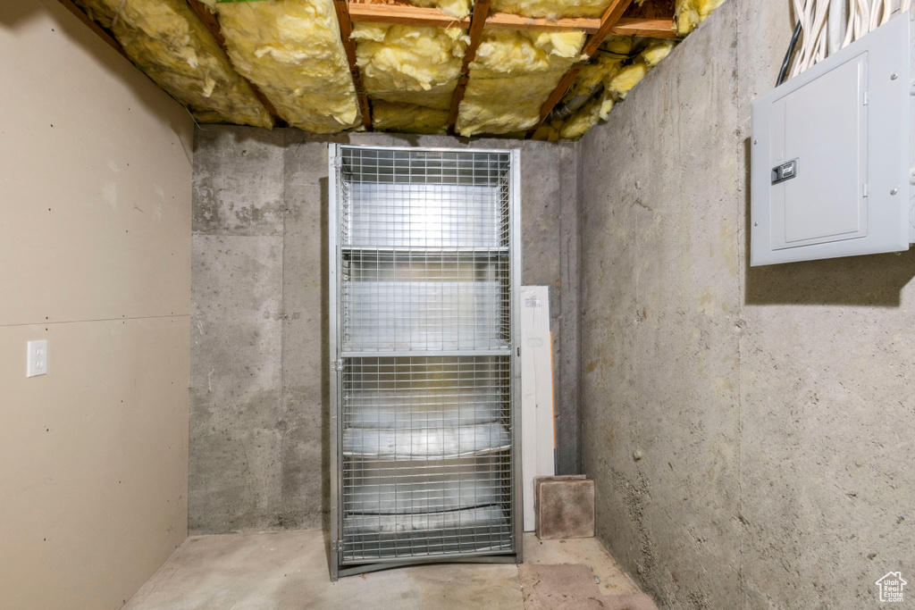 Unfinished basement featuring electric panel