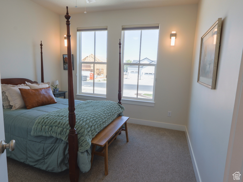 Carpeted bedroom with baseboards