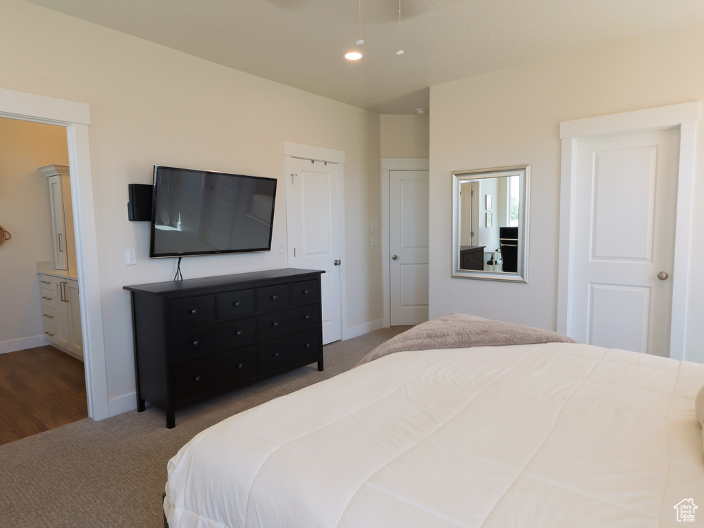 Carpeted bedroom featuring baseboards and recessed lighting