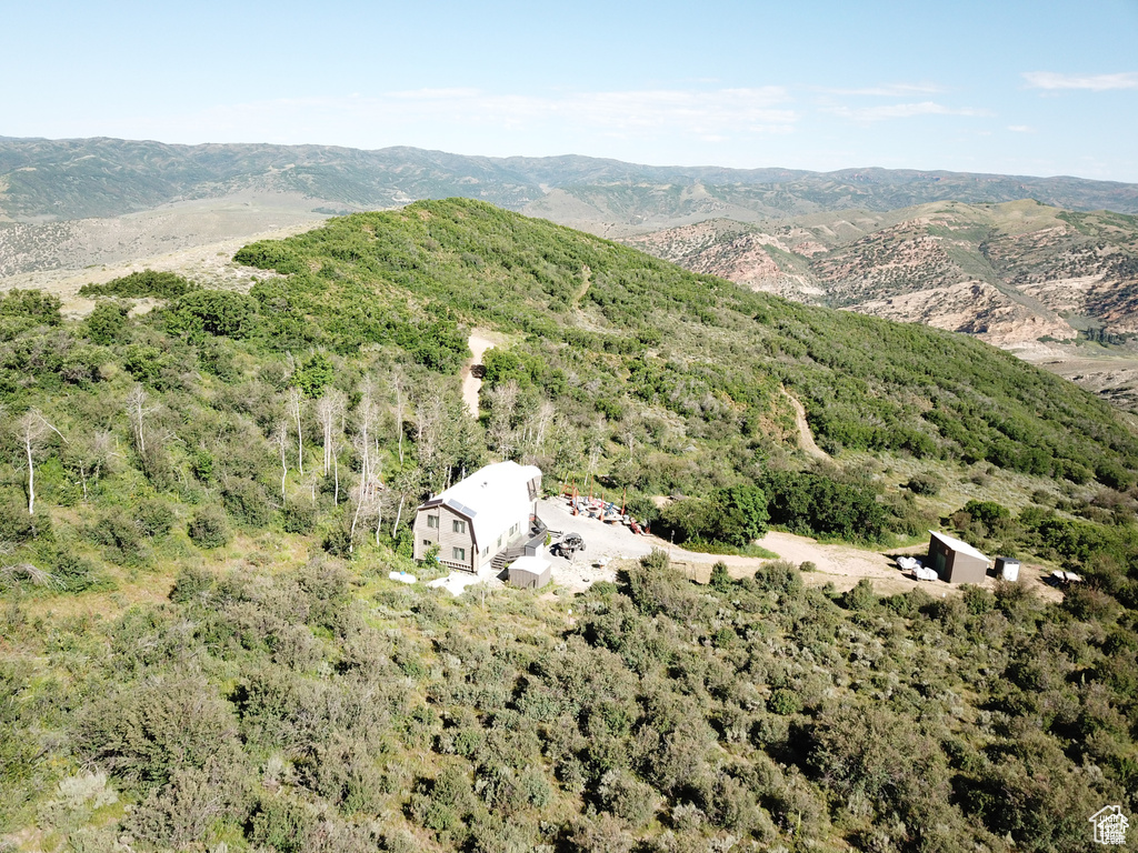 View of subject property with a mountain backdrop
