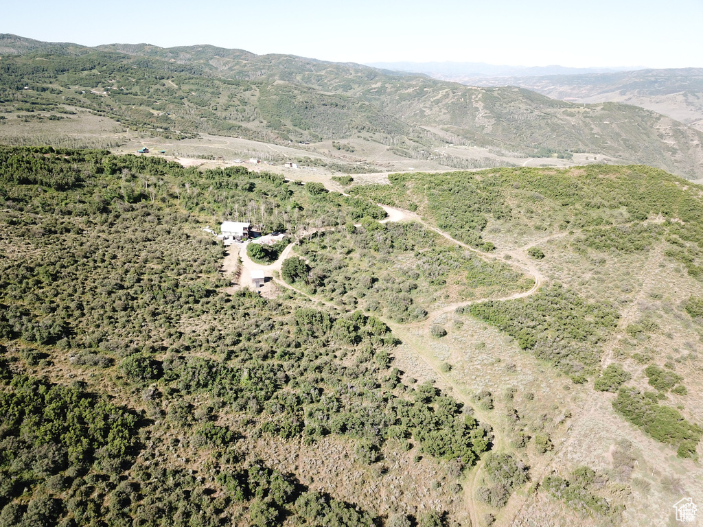 Aerial overview of property's location featuring a mountain backdrop