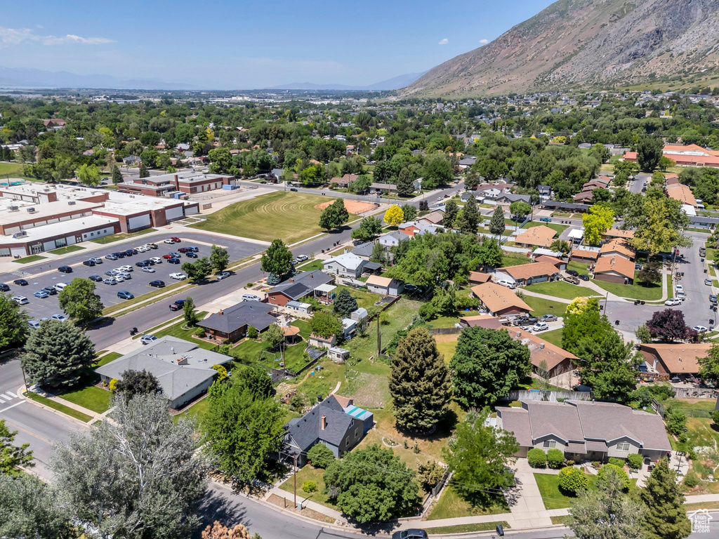 Aerial perspective of suburban area with a mountainous background