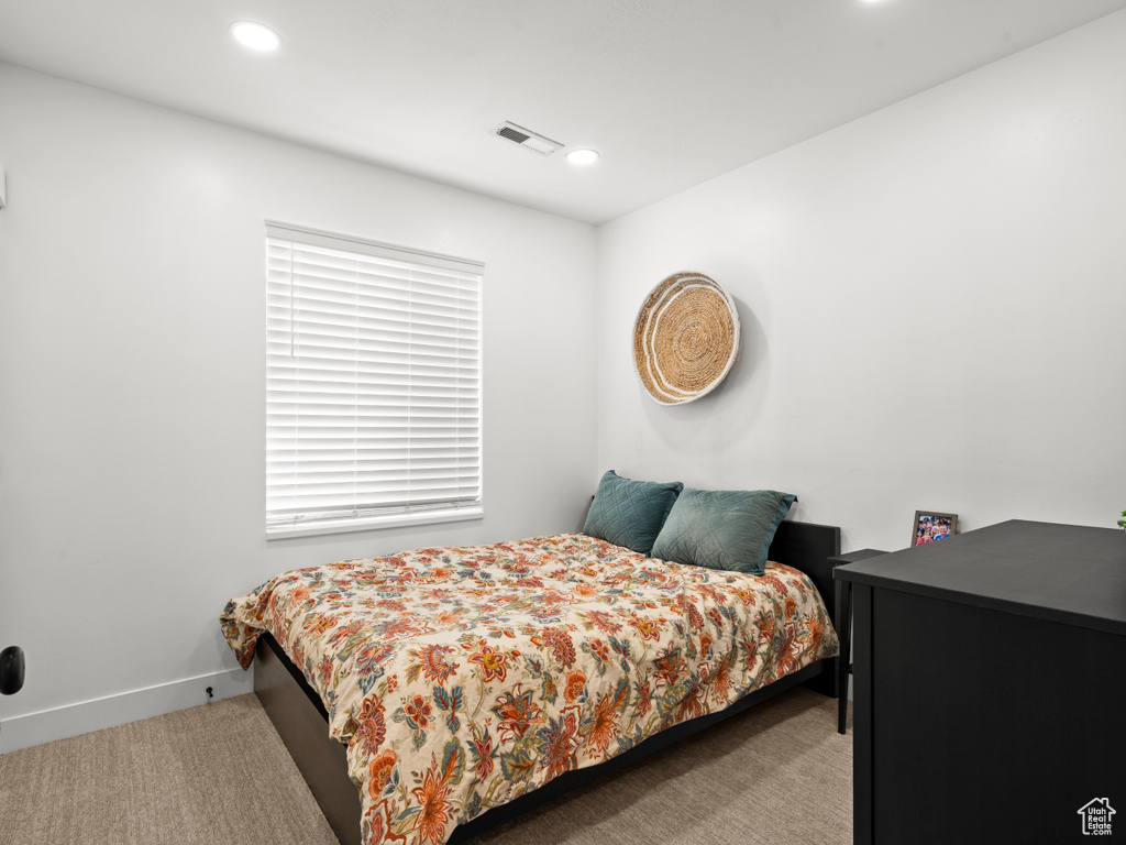 Bedroom with carpet, baseboards, and recessed lighting
