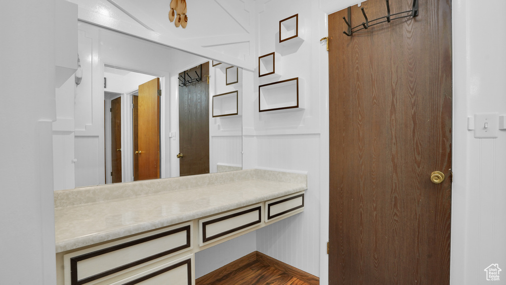 Bathroom featuring vanity and wood finished floors