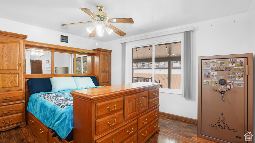 Bedroom featuring refrigerator, dark wood finished floors, access to outside, baseboards, and ceiling fan