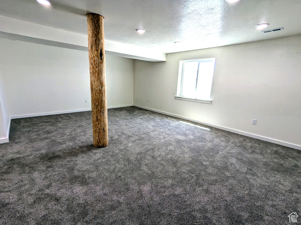 Basement with carpet and baseboards