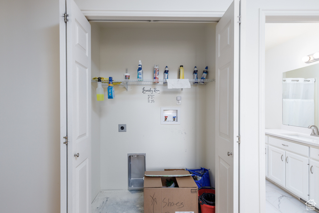 Laundry room with electric dryer hookup and hookup for a washing machine