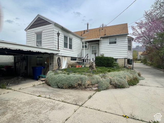 View of front facade with concrete driveway