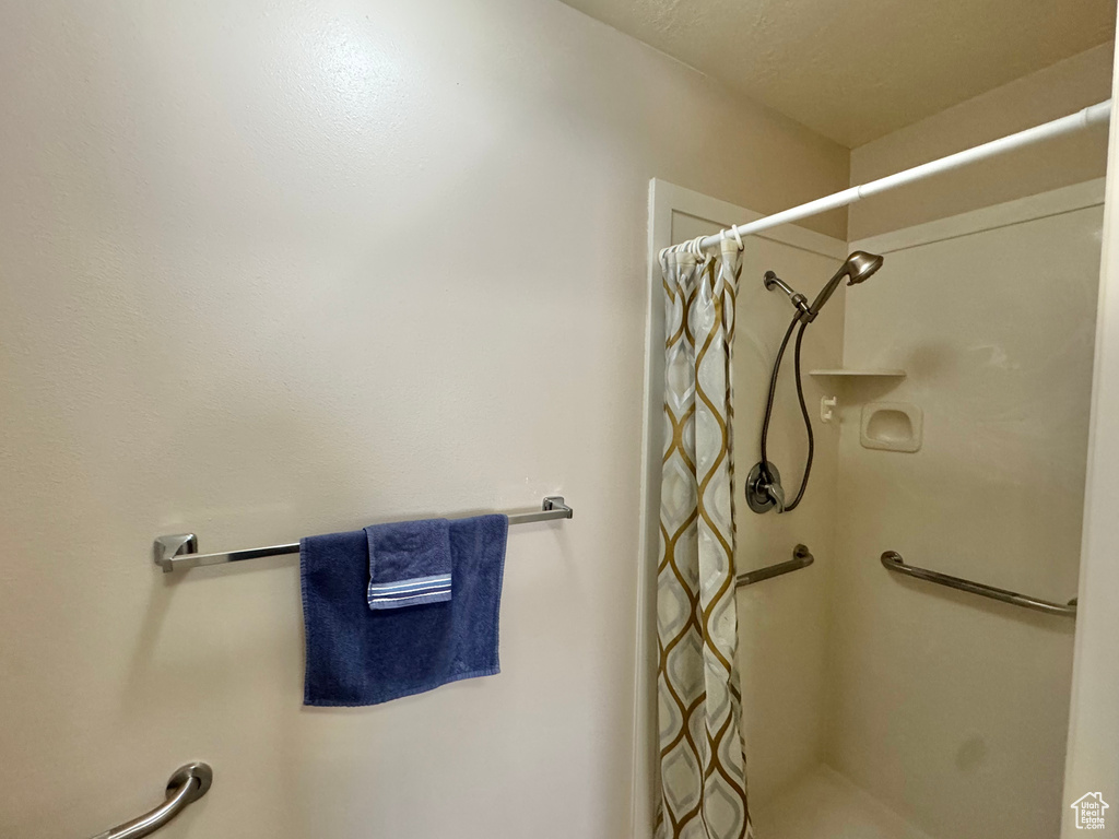 Full bath featuring curtained shower