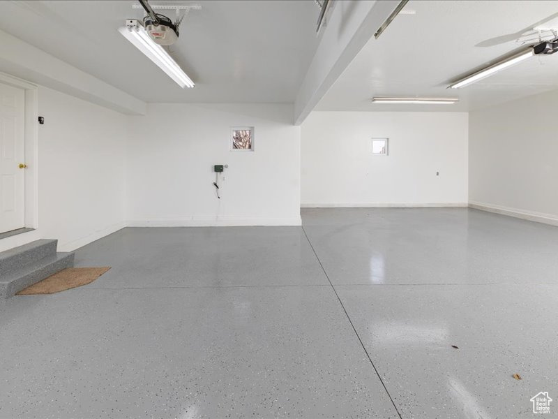 Garage featuring a garage door opener