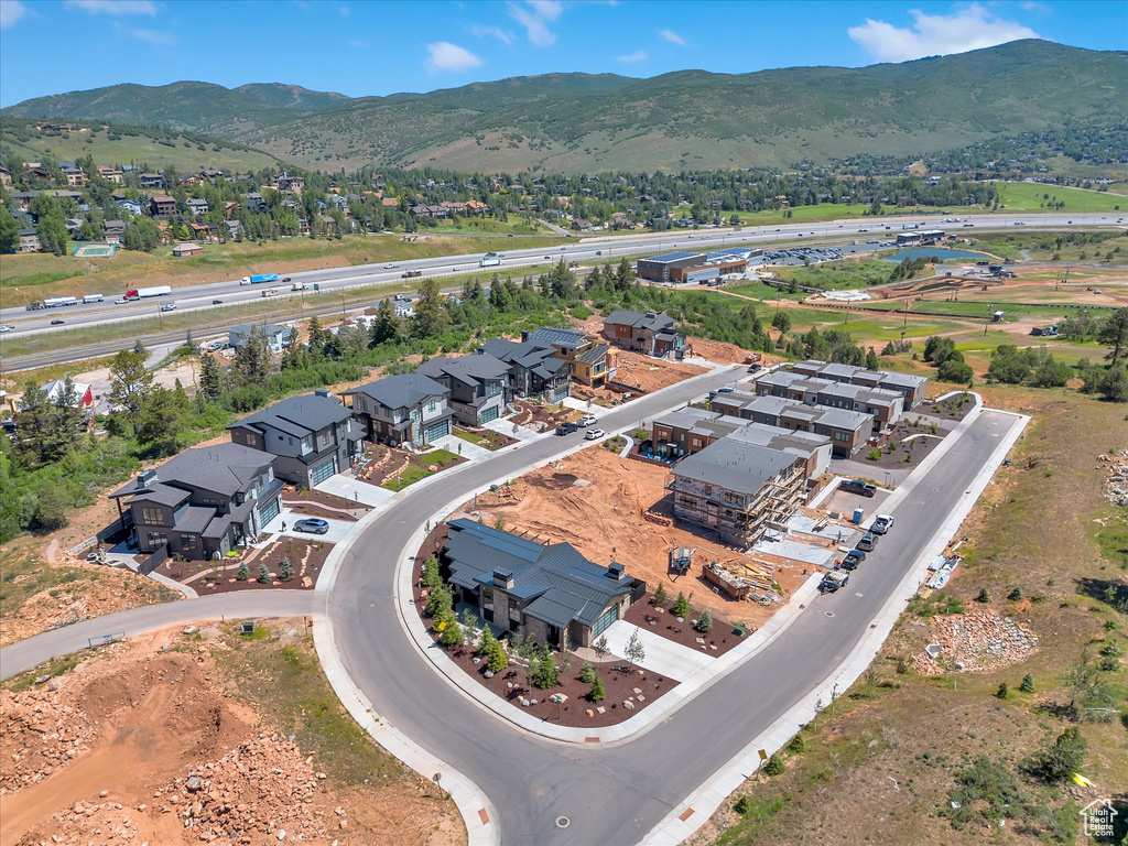 Aerial perspective of suburban area featuring a mountain backdrop