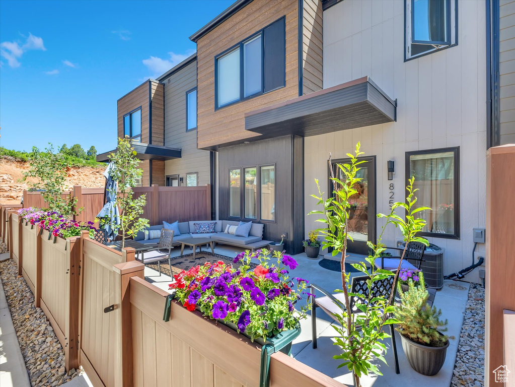 View of patio / terrace featuring an outdoor living space and central AC