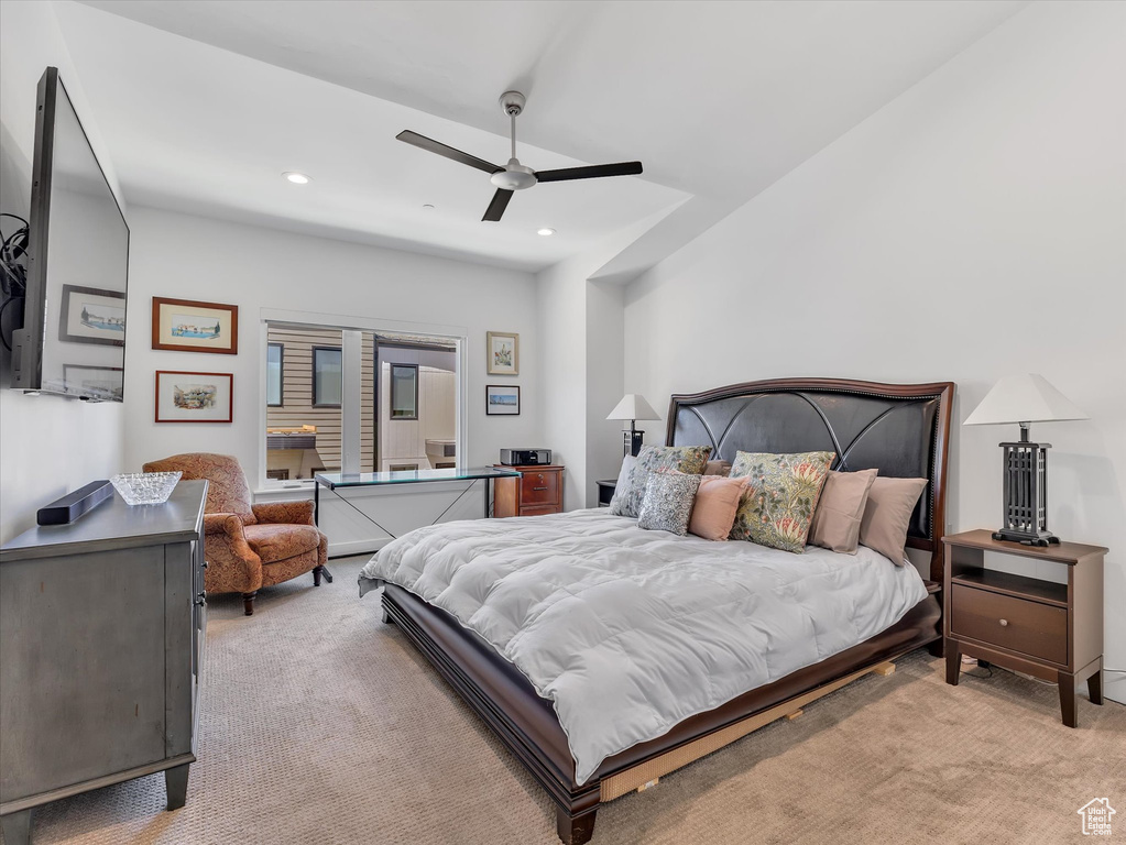 Bedroom featuring light carpet, a ceiling fan, and recessed lighting