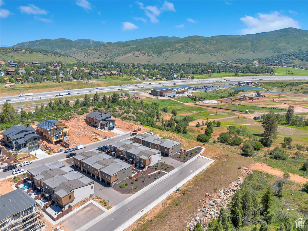 Aerial perspective of suburban area with a mountainous background