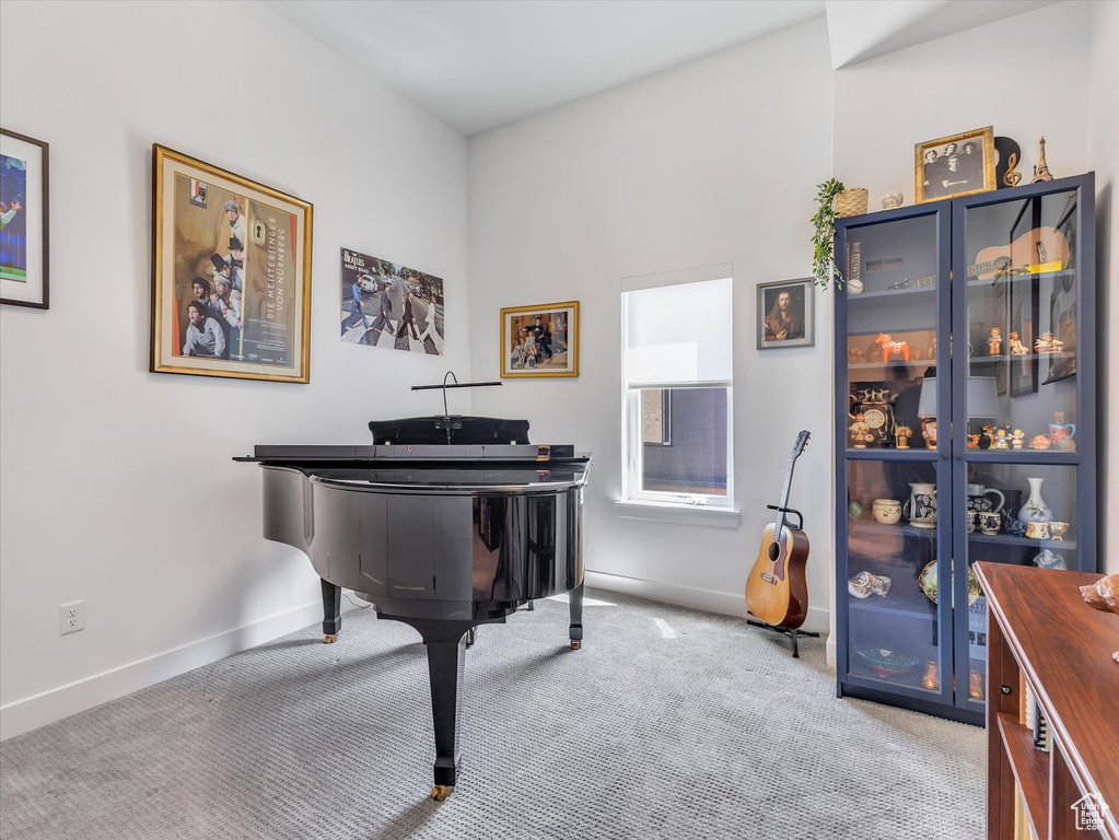 Living area with carpet floors and baseboards