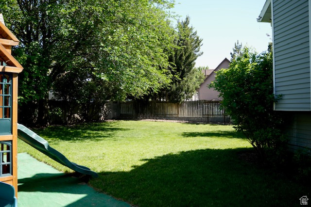 View of yard featuring a playground