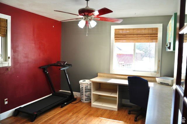 Office with a ceiling fan and wood finished floors