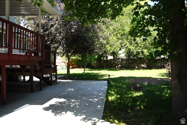 View of yard featuring a patio area and a deck