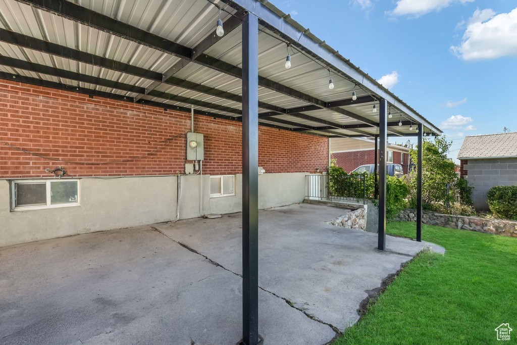 View of patio with a carport