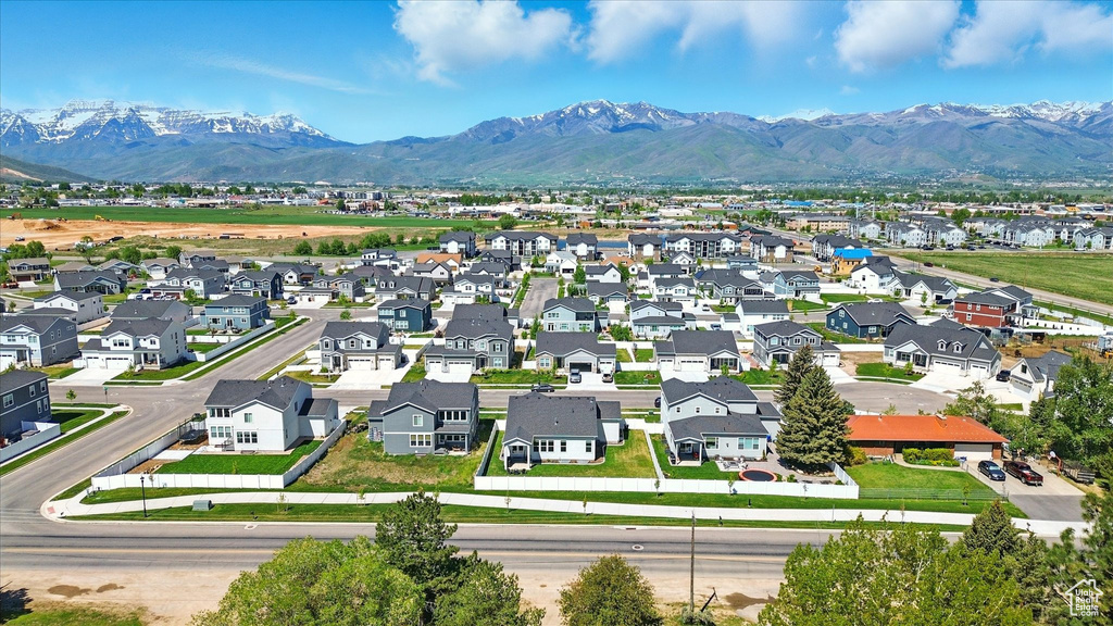 Aerial perspective of suburban area featuring a mountain backdrop