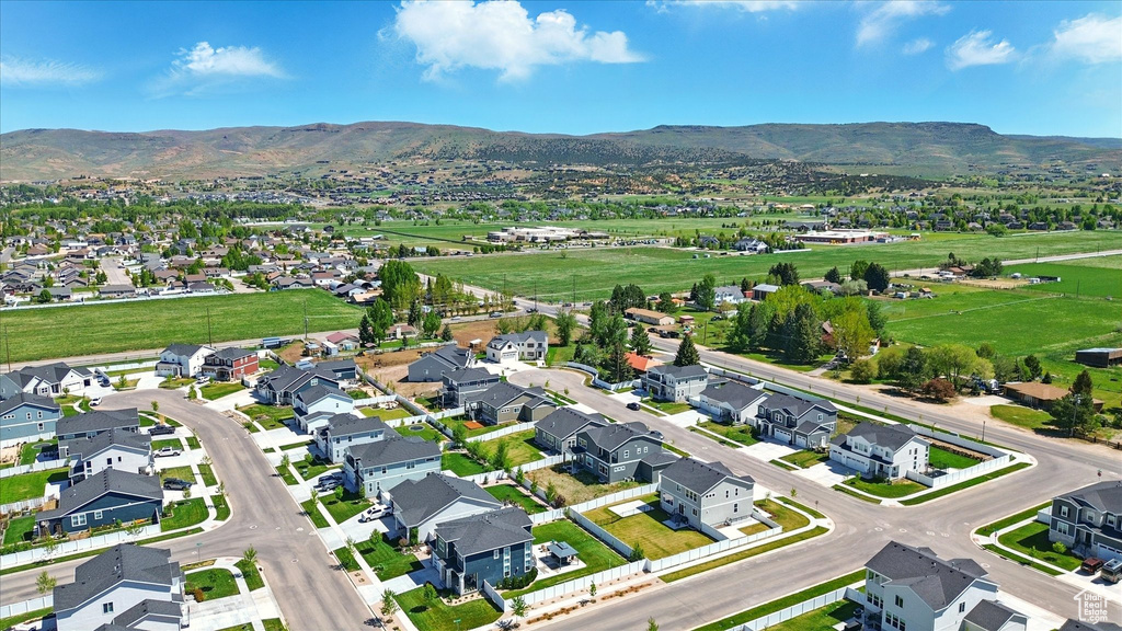 Aerial view of residential area with a mountainous background