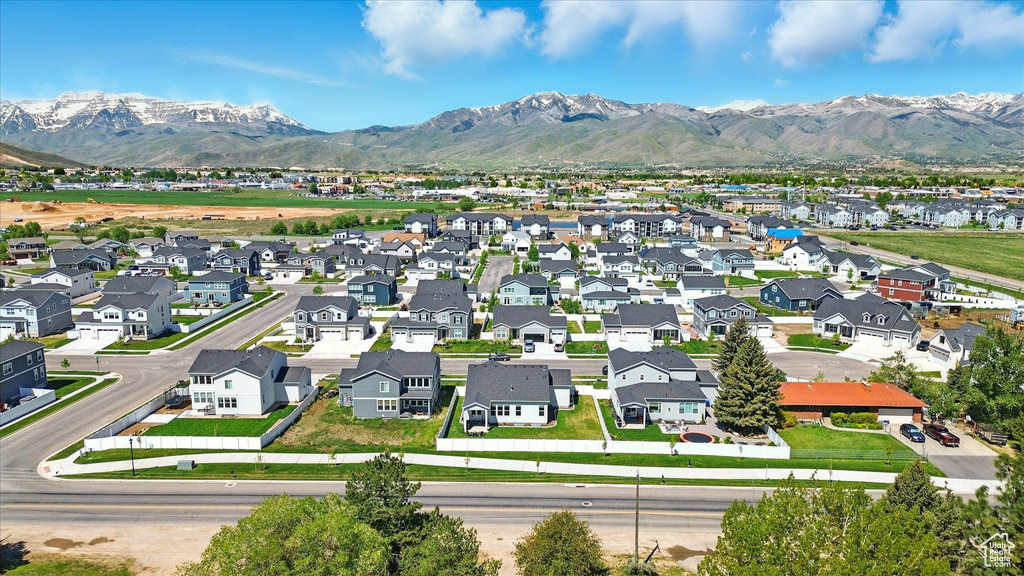 Aerial perspective of suburban area with a mountainous background