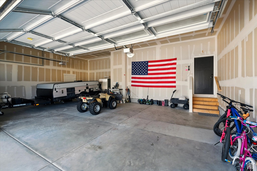 Garage featuring a garage door opener