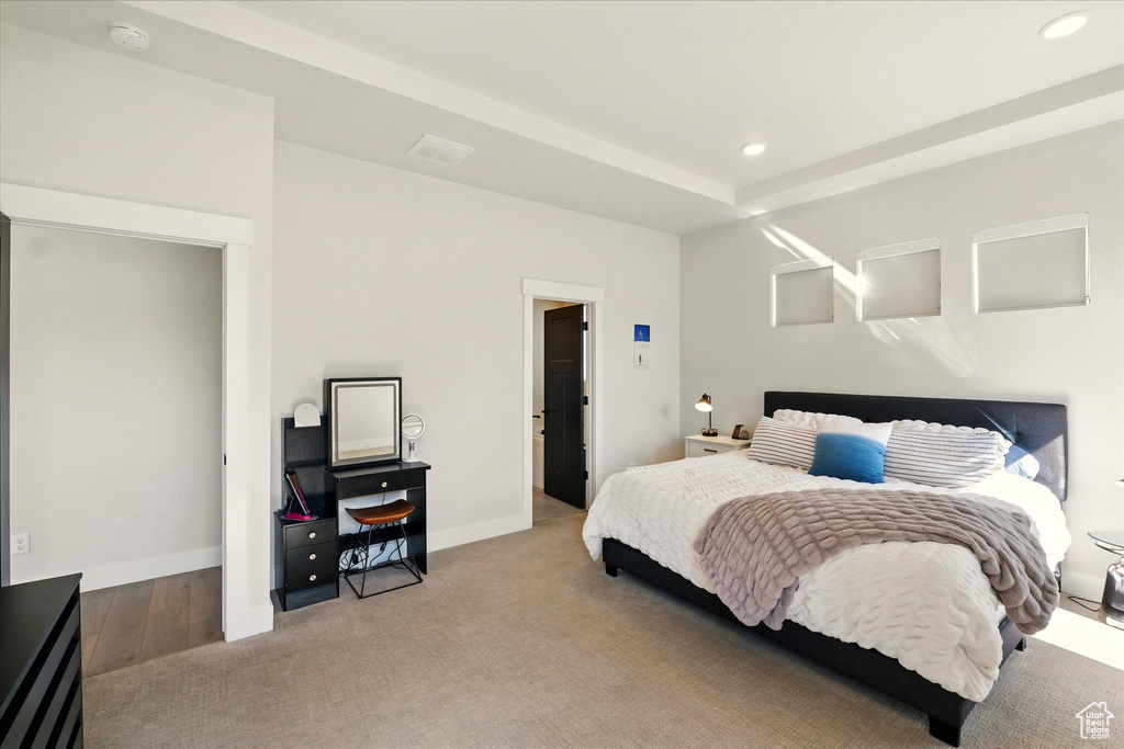 Bedroom featuring recessed lighting, light colored carpet, and baseboards