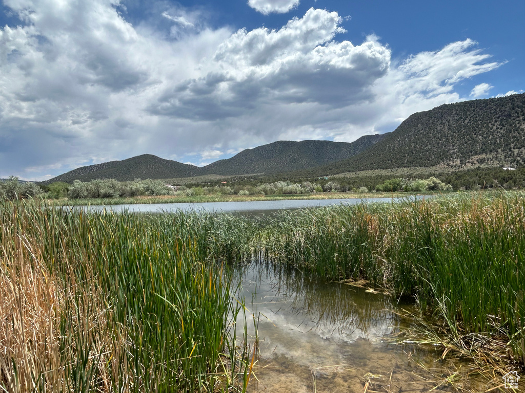 Mountain view featuring a nearby body of water