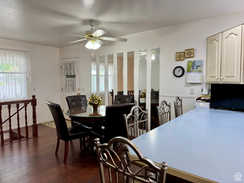 Dining area featuring ceiling fan and dark wood finished floors