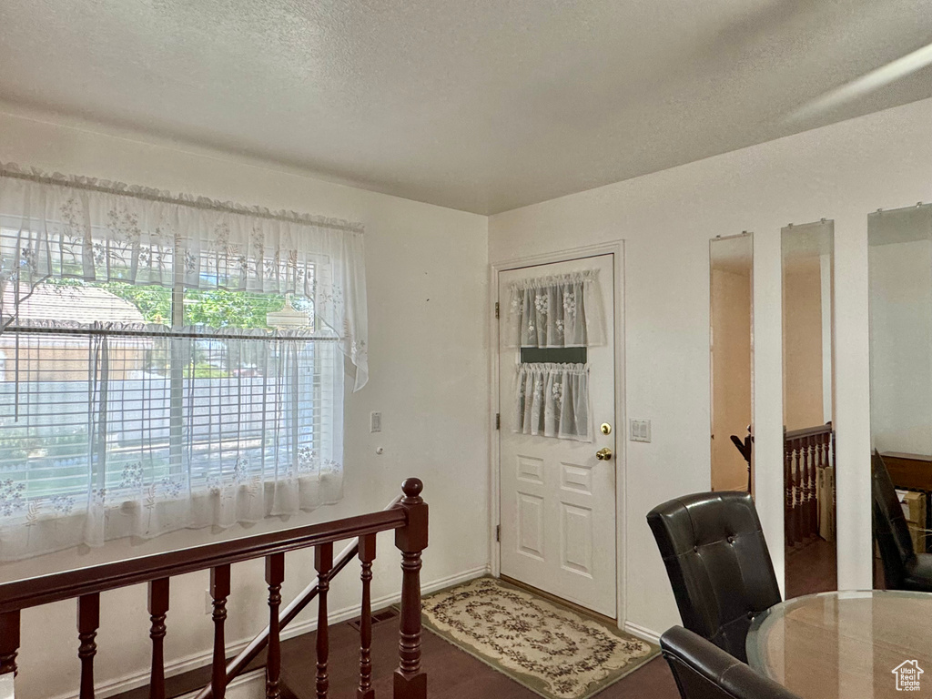 Home office with a textured ceiling and baseboards