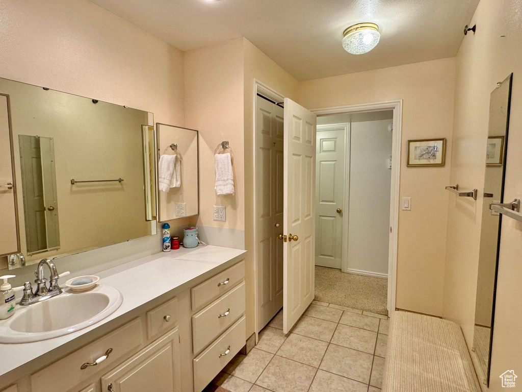 Bathroom featuring vanity and tile patterned floors