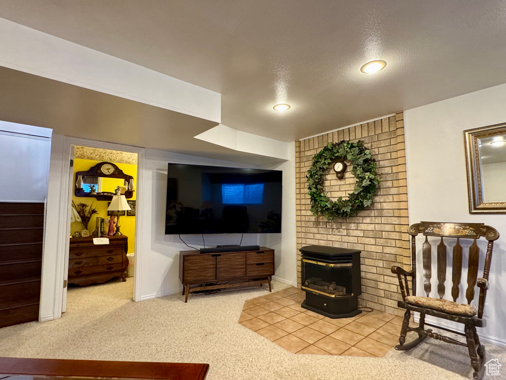 Carpeted living room featuring recessed lighting, stairs, and a textured ceiling