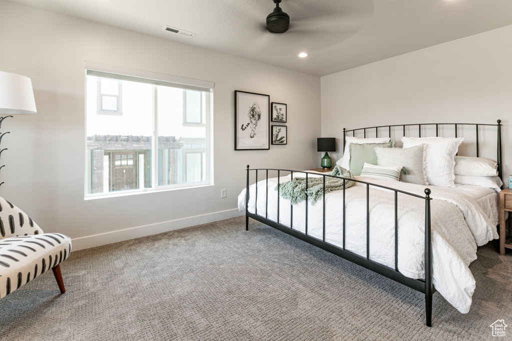 Carpeted bedroom featuring recessed lighting and ceiling fan