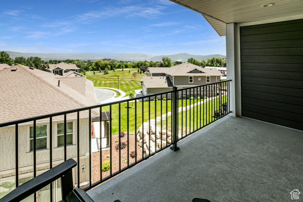 Balcony featuring a mountain view and a residential view