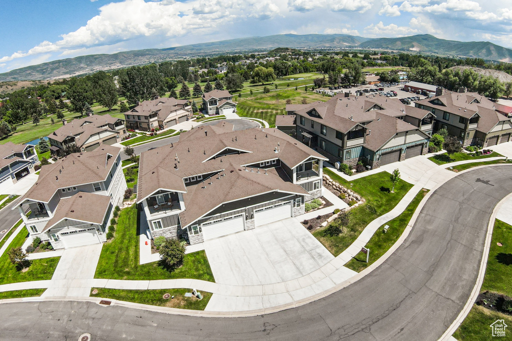 Aerial view of residential area featuring mountains