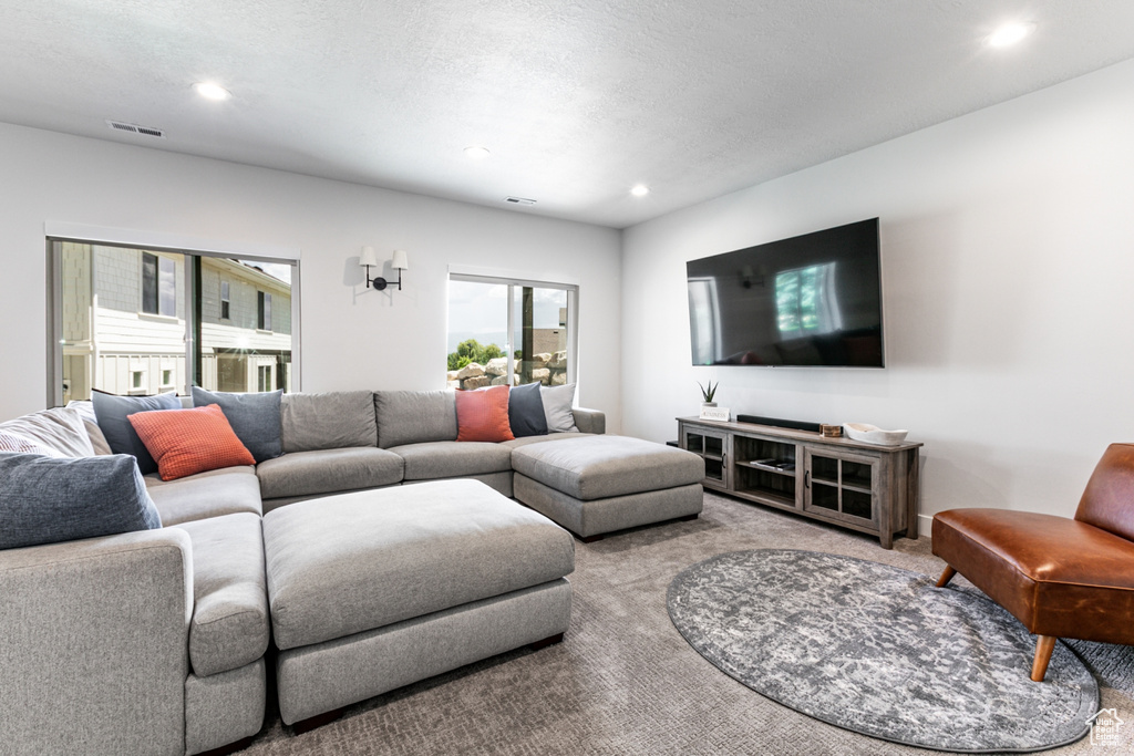 Living room with carpet and recessed lighting