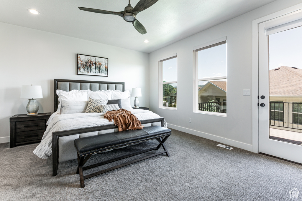 Bedroom with carpet flooring, multiple windows, access to outside, and recessed lighting