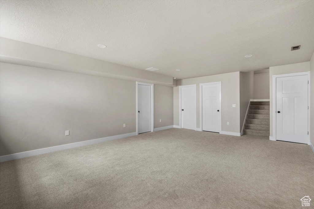 Unfurnished bedroom with baseboards and carpet floors