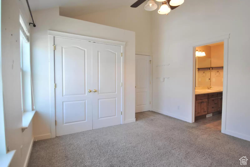 Unfurnished bedroom featuring carpet, a closet, and baseboards