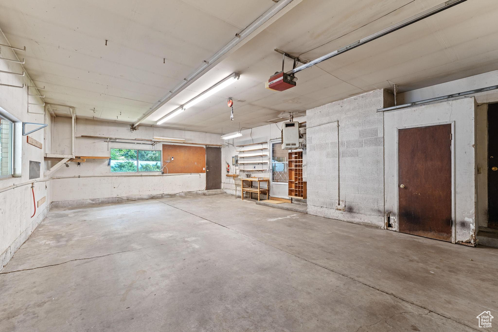 Garage featuring a garage door opener